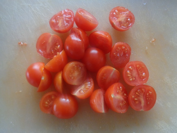 Cut the cherry tomatoes in half