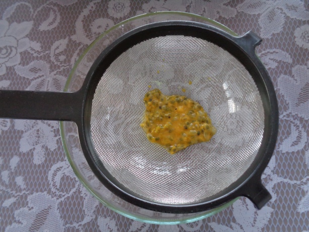 Give the bulp of the passion fruit in a sieve