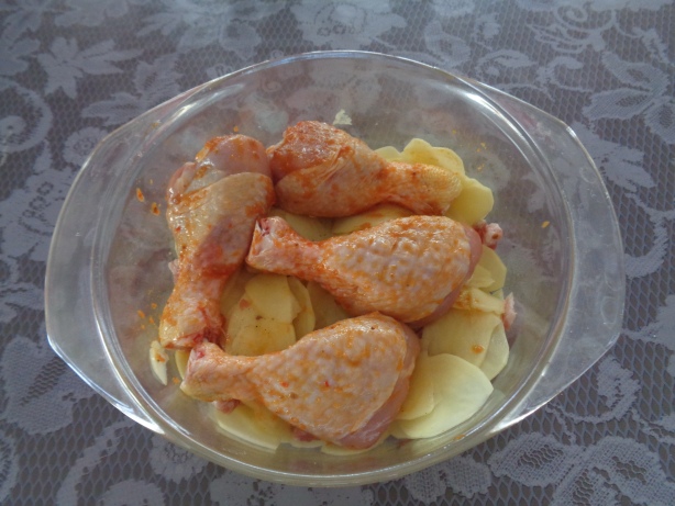 Lay the chicken pieces on the potatoes