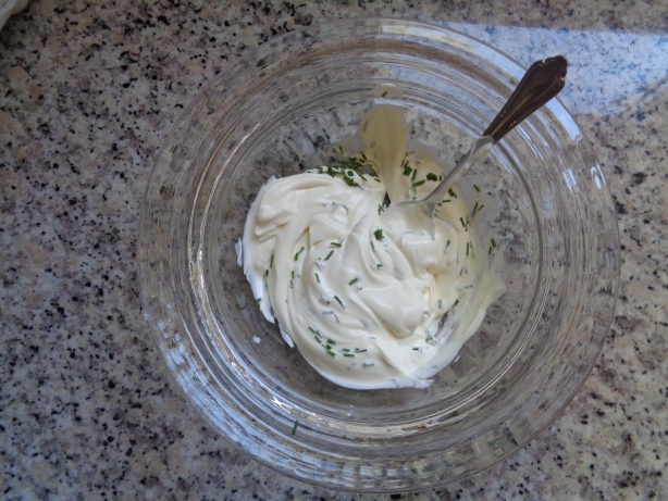 Add the crème fraîche or cream and the chive into a bowl
