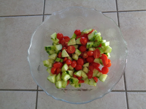 Add the tomatos, cucumbers and some olive oil into a bowle and stir