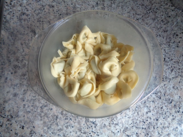 Add the tortellini in into the baking dish