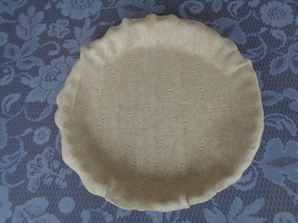 Kuchenteig auf Backform legen